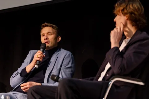 Josh de Buhr on stage with Simon Rolfes at the LSE German Symposium 2026.